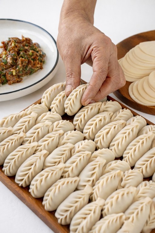 Hand-folded dumplings by Chef Zhou Zhou