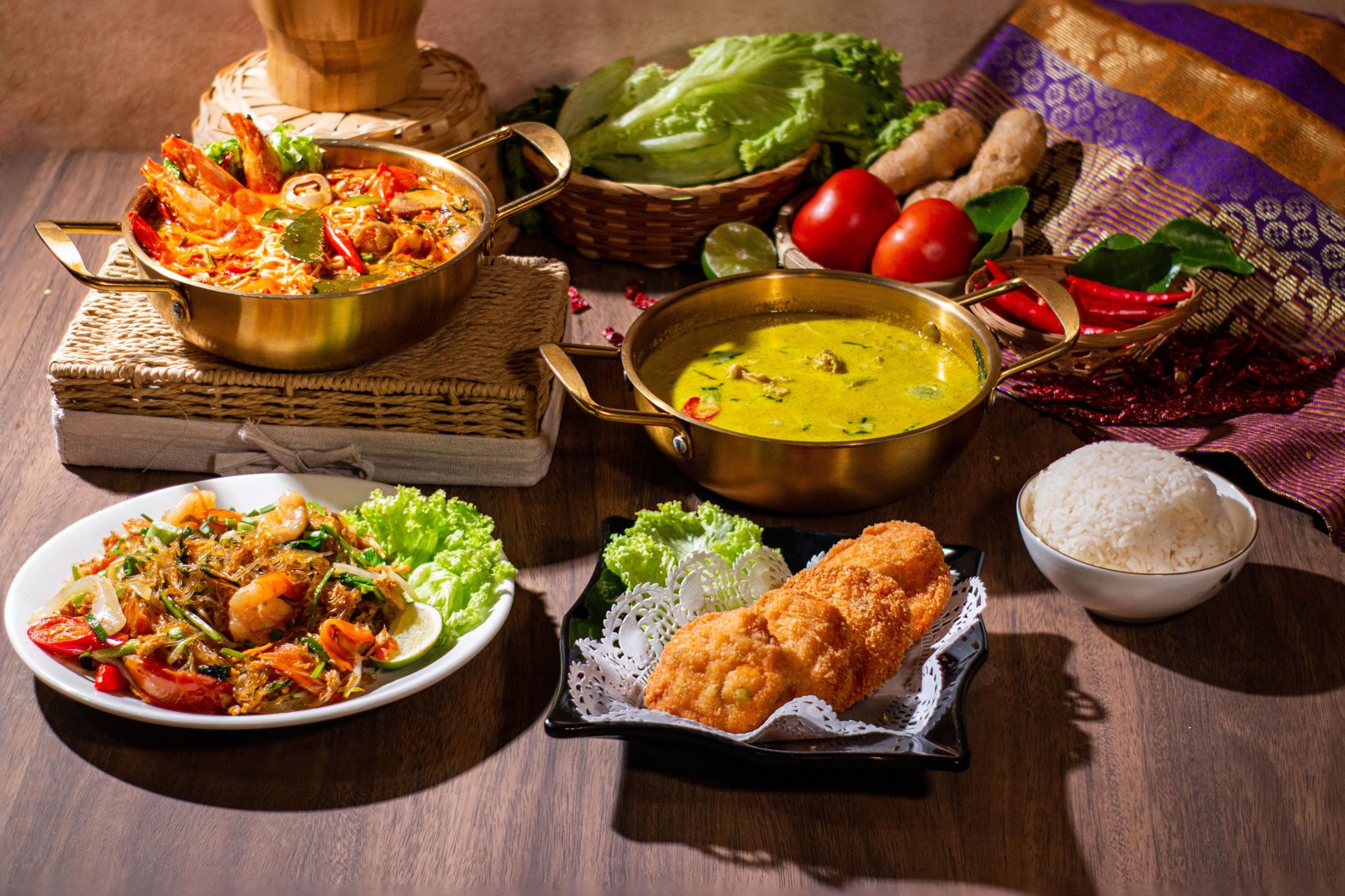 Hom Siam Thai food spread — tom yum, krapow, curry